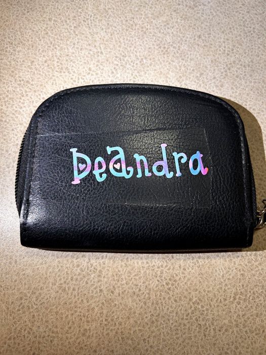 Black wallet with a holographic personalized name